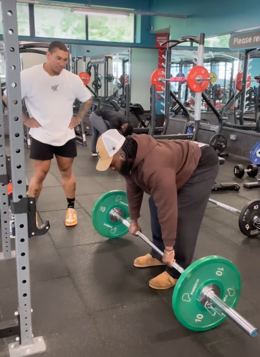 Jonny Goodall coaching a client's deadlift technique