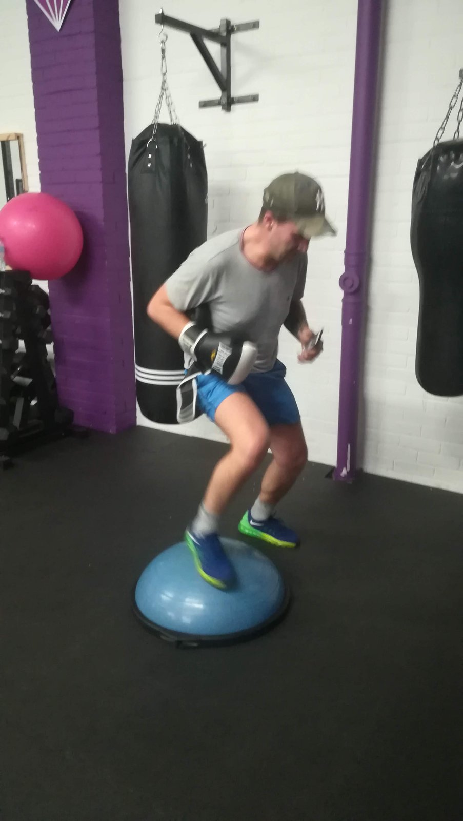 Boxing balance drill on a bosu ball, coaching session