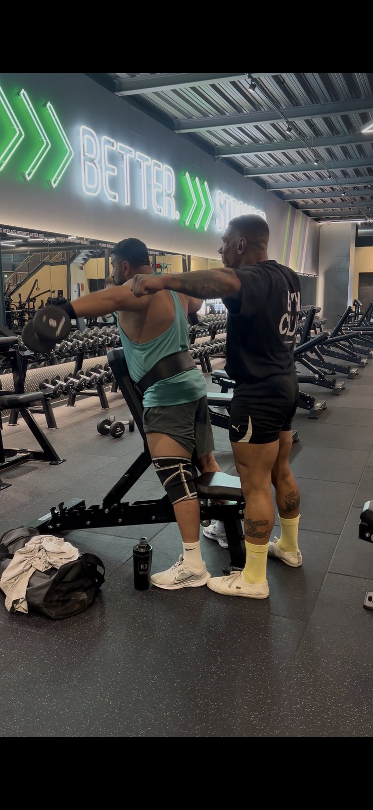 Jonny Goodall coaching a client's shoulder press technique